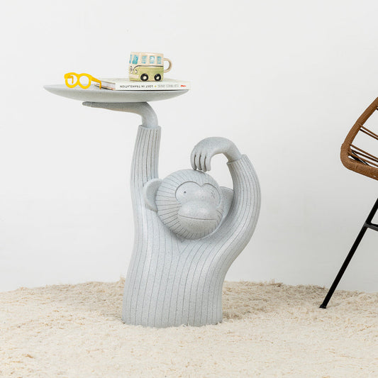 Mesa auxiliar con figura de mono decorativa