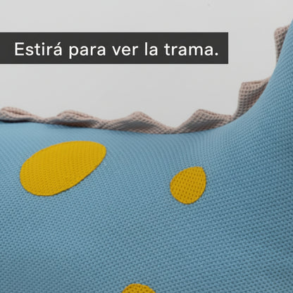 Puf con forma de dinosaurio con detalle de la trama de la tela