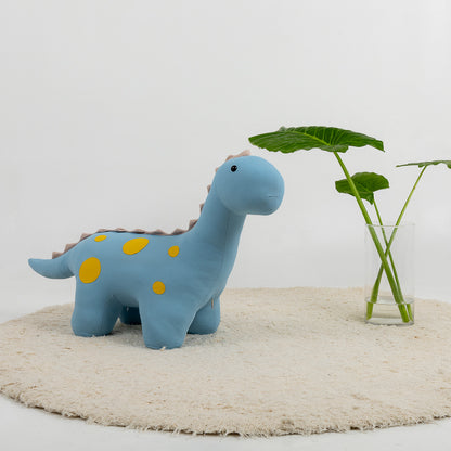 Puf con forma de dinosaurio en celeste