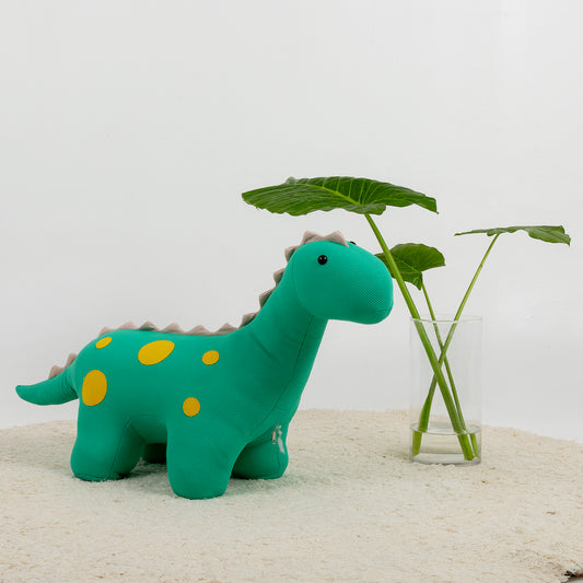 Puf con forma de dinosaurio en verde